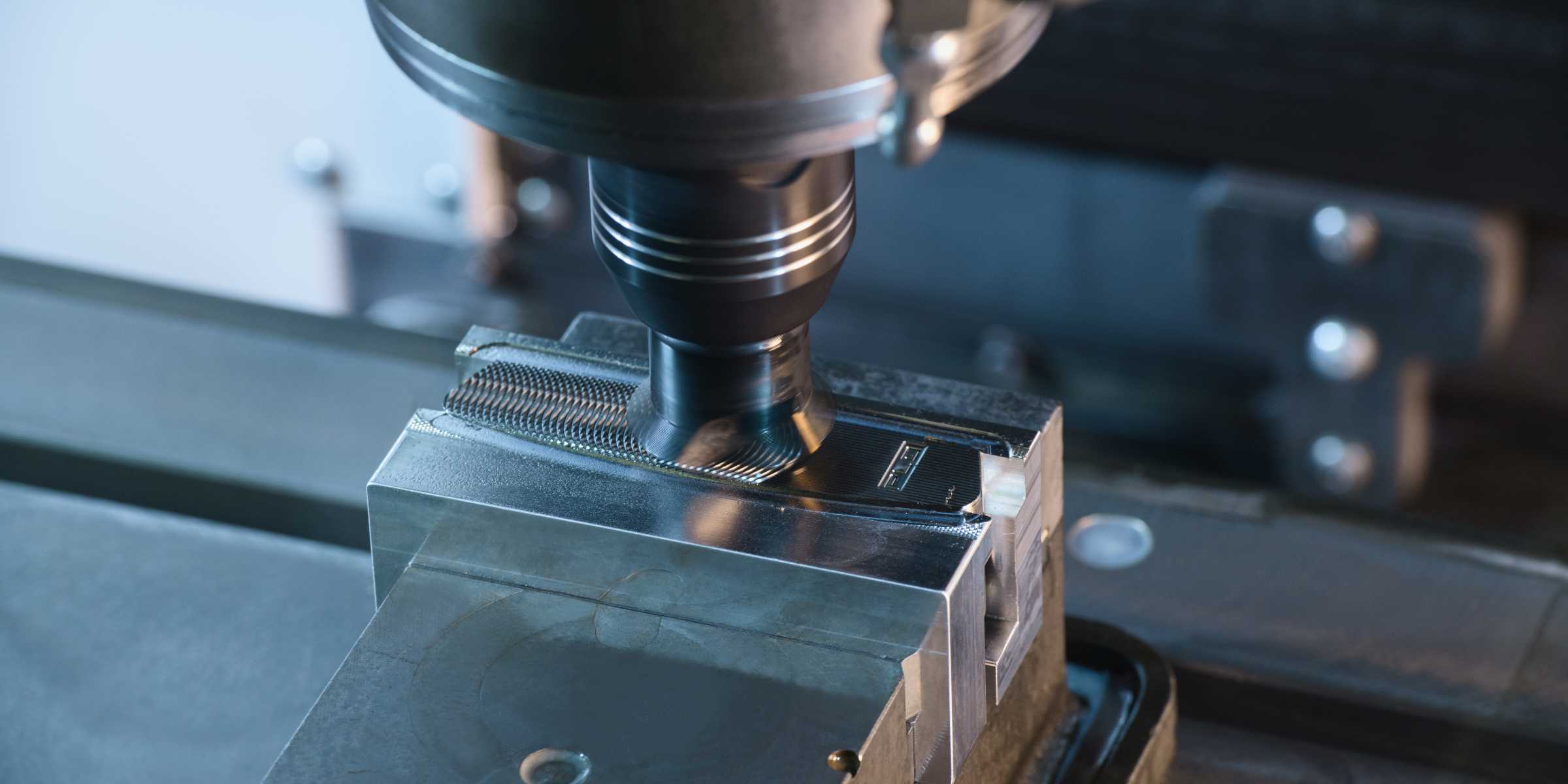 milling machine cutting grooves in a putter face