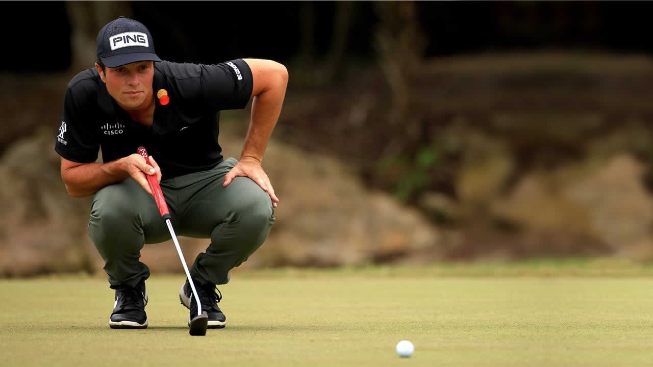 PING pro Viktor Hovland lines up a putt